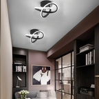 Moderne LED-Deckenleuchte mit verschlungenen Leuchtringen